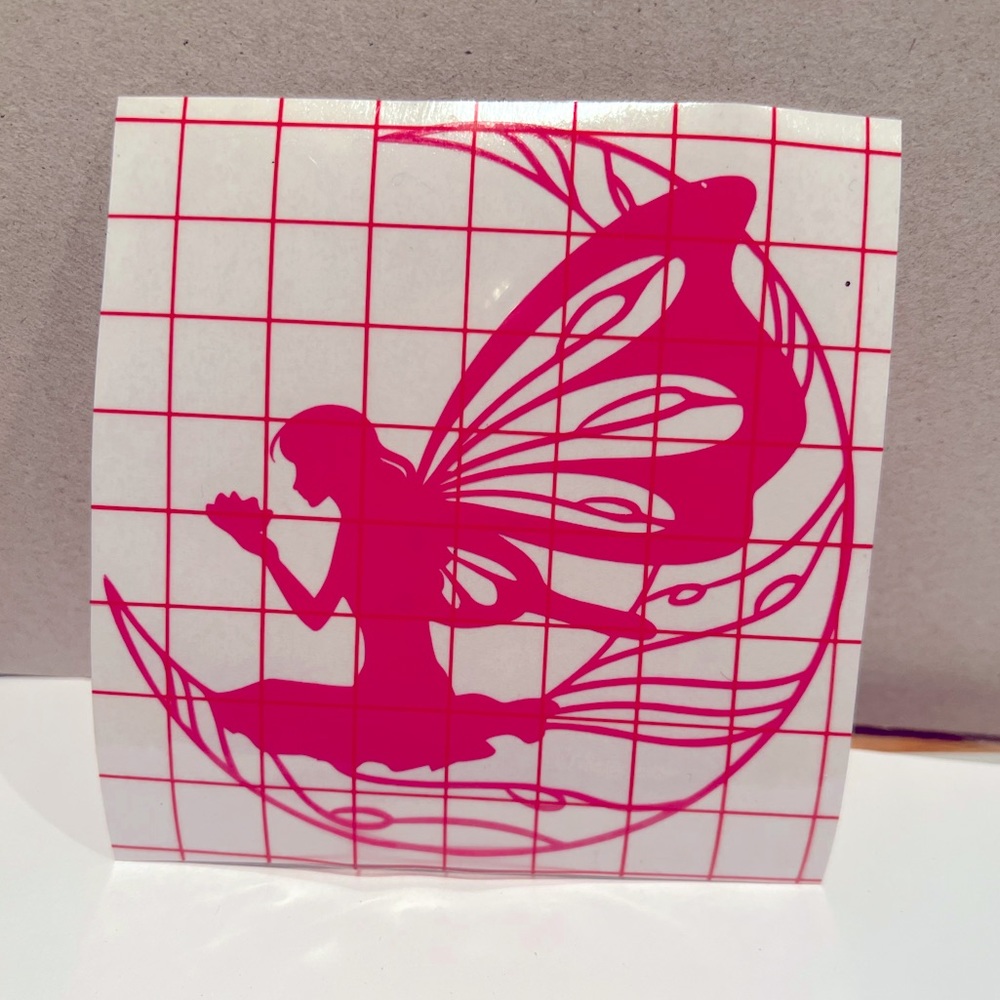 Angel/fairy sitting on half moonvinyl typically used for car windows or tumblers